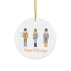 Round ceramic ornament with nutcrackers and 'happy VOLidays' text on a white background