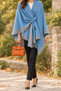 Blue cape wrap styled with black slacks, heels and orange Mini UTote, neck-down framing