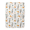 Patterned fabric with nutcrackers and pumpkins on a white background